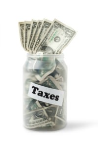Taxes jar with money inside